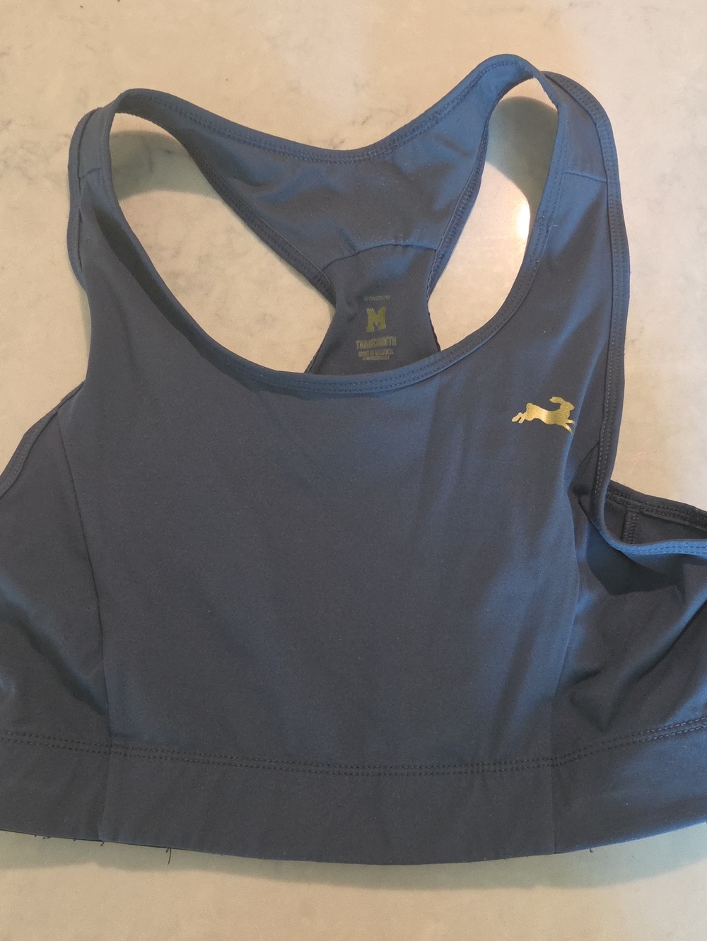 Tracksmith Navy Racerback Sports Bra with Gold Pony Emblem